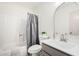 Clean bathroom featuring neutral paint, a sink with modern fixtures, and a shower-tub combo at 1517 E Dunbar Dr, Tempe, AZ 85282