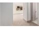 Bright bedroom featuring neutral carpet, baseboards, and trim, with an outside view through a window at 1517 E Dunbar Dr, Tempe, AZ 85282