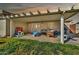 Inviting back patio with a pergola, creating a relaxing outdoor space for gatherings and leisure at 1565 W Plana Ave, Mesa, AZ 85202