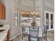 Breakfast nook featuring a chandelier and multiple windows with backyard views at 15819 W Ripple Rd, Goodyear, AZ 85338