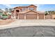 Charming home featuring a three-car garage, neutral paint, and low-maintenance desert landscaping at 15819 W Ripple Rd, Goodyear, AZ 85338