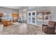 Well-lit kitchen with center island, breakfast nook, and double French doors leading to the backyard at 15819 W Ripple Rd, Goodyear, AZ 85338