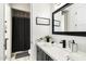 Well-lit bathroom featuring modern fixtures, a marble countertop, and a stylish mirror at 16908 S 31St Ln, Phoenix, AZ 85045