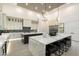 Gourmet kitchen featuring a large island with seating and stainless steel appliances at 16908 S 31St Ln, Phoenix, AZ 85045