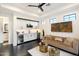 Living room with wet bar, kitchenette, comfortable seating and bright lighting at 16908 S 31St Ln, Phoenix, AZ 85045