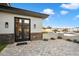 Outdoor patio area with a stone facade and pavers, offering a great space for relaxation at 16908 S 31St Ln, Phoenix, AZ 85045