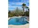 Backyard pool surrounded by desert landscaping with mountain views on a bright, sunny day at 17020 E Oro Grande Dr, Fountain Hills, AZ 85268