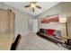 Bedroom featuring a sofa, carpet floors, and a window at 17210 N Firestone Ln, Surprise, AZ 85374