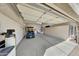 View of garage with parking and storage, and golf cart parked inside at 17210 N Firestone Ln, Surprise, AZ 85374