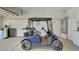 Garage featuring a golf cart and storage at 17210 N Firestone Ln, Surprise, AZ 85374