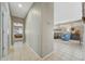 Hallway leading to living room and bedroom with neutral paint and tile flooring at 17210 N Firestone Ln, Surprise, AZ 85374