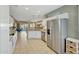 Bright kitchen featuring stainless steel refrigerator and views to the backyard living space at 17210 N Firestone Ln, Surprise, AZ 85374