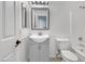 Bright bathroom features a vanity, mirror, and tiled floors at 1726 E Cortez Dr, Casa Grande, AZ 85122