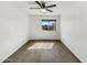 Bedroom with wood flooring, a ceiling fan, and natural light at 1726 E Cortez Dr, Casa Grande, AZ 85122