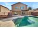 Backyard featuring a private pool with a covered patio area at 1726 E Cortez Dr, Casa Grande, AZ 85122