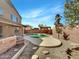 Backyard pool with a beautiful stone patio at 1726 E Cortez Dr, Casa Grande, AZ 85122