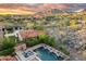 Home's backyard pool, spa and desert views in an elevated setting at 18683 N 101St Pl, Scottsdale, AZ 85255