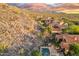 Mountain view of a backyard featuring a swimming pool, spa, and outdoor seating at 18683 N 101St Pl, Scottsdale, AZ 85255