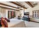 Bedroom with a dark wood ceiling and a four-poster bed featuring an outside view at 18683 N 101St Pl, Scottsdale, AZ 85255