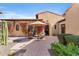 Secluded outdoor courtyard with desert landscaping, comfortable seating, and covered patio at 18683 N 101St Pl, Scottsdale, AZ 85255