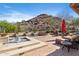 Beautiful pool and spa area features desert landscaping, mountains, and an inviting lounge area for relaxing at 18683 N 101St Pl, Scottsdale, AZ 85255