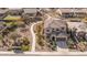 Aerial view of a desert home with drought-resistant landscaping, sidewalk trails, and a beautiful tile roof at 18811 W San Miguel Ave, Litchfield Park, AZ 85340