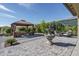 This private backyard is an entertainer's dream, with a seating area and decorative fountain at 18811 W San Miguel Ave, Litchfield Park, AZ 85340