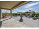 This covered patio offers a seating area, pool and fountain for relaxing and entertaining outdoors at 18811 W San Miguel Ave, Litchfield Park, AZ 85340