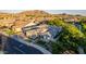 An aerial view of this home shows mature landscaping, roof with large solar array, and neighborhood at 1925 E La Costa Dr, Gilbert, AZ 85298