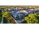 An aerial view reveals a backyard pool, roof-mounted solar panels, and lush landscaping at 1925 E La Costa Dr, Gilbert, AZ 85298