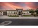 Striking single-story home featuring stone accents, manicured landscaping, and a barrel roof in a serene neighborhood at 1925 E La Costa Dr, Gilbert, AZ 85298