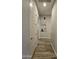 Neutral hallway with wood-look tile flooring and white trim at 1925 E La Costa Dr, Gilbert, AZ 85298