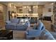 View of the living room leading into the open-concept kitchen with large island at 1925 E La Costa Dr, Gilbert, AZ 85298