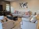 Comfortable living room with sectional couch, arm chairs, and a neutral color palette at 1925 E La Costa Dr, Gilbert, AZ 85298