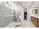 Modern bathroom with a glass-enclosed shower and tile surround at 19919 W Harrison St, Buckeye, AZ 85326