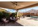 Inviting covered patio with ample seating, perfect for outdoor relaxation at 19919 W Harrison St, Buckeye, AZ 85326