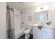 Updated bathroom with shower, framed mirror, and a white vanity at 2016 N Pennington Dr, Chandler, AZ 85224