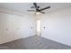 A bedroom with neutral carpet, a ceiling fan, and a closet at 2016 N Pennington Dr, Chandler, AZ 85224