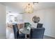 Chic dining area showcases modern light fixture and comfortable seating at 2016 N Pennington Dr, Chandler, AZ 85224