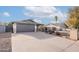 Single-story home with a spacious driveway and well-maintained landscaping at 2016 N Pennington Dr, Chandler, AZ 85224