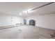 A spacious garage with a water heater and concrete flooring at 2016 N Pennington Dr, Chandler, AZ 85224