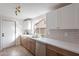 Modern kitchen showcases white quartz countertops and a stylish stainless steel appliance suite at 2016 N Pennington Dr, Chandler, AZ 85224