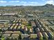 A high aerial view showcases the property's convenient location near shopping centers and its proximity to desert mountain views at 2150 E Bell Rd # 1134, Phoenix, AZ 85022