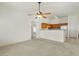 Open concept living room showcasing the adjacent kitchen area with white appliances at 2150 E Bell Rd # 1134, Phoenix, AZ 85022