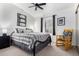 Bedroom featuring neutral walls, ceiling fan, and a large window providing bright natural light and a comfortable space at 2169 E Alameda Dr, Tempe, AZ 85282