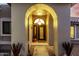 Inviting arched entryway featuring a decorative pendant light and beautifully detailed double doors at 2169 E Alameda Dr, Tempe, AZ 85282