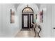 Elegant foyer featuring a decorative console table, tiled flooring, and a beautiful stained-glass front door at 2169 E Alameda Dr, Tempe, AZ 85282