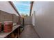 Narrow side yard with gravel and a tool shed at 2169 E Alameda Dr, Tempe, AZ 85282