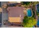 Stunning aerial view of a private pool, deck, and well-maintained landscaping on a home with a clay tile roof at 2633 E Amber Ridge Way, Phoenix, AZ 85048