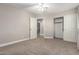 Neutral bedroom with carpet, ceiling fan, closet with sliding doors, and natural light at 2633 E Amber Ridge Way, Phoenix, AZ 85048